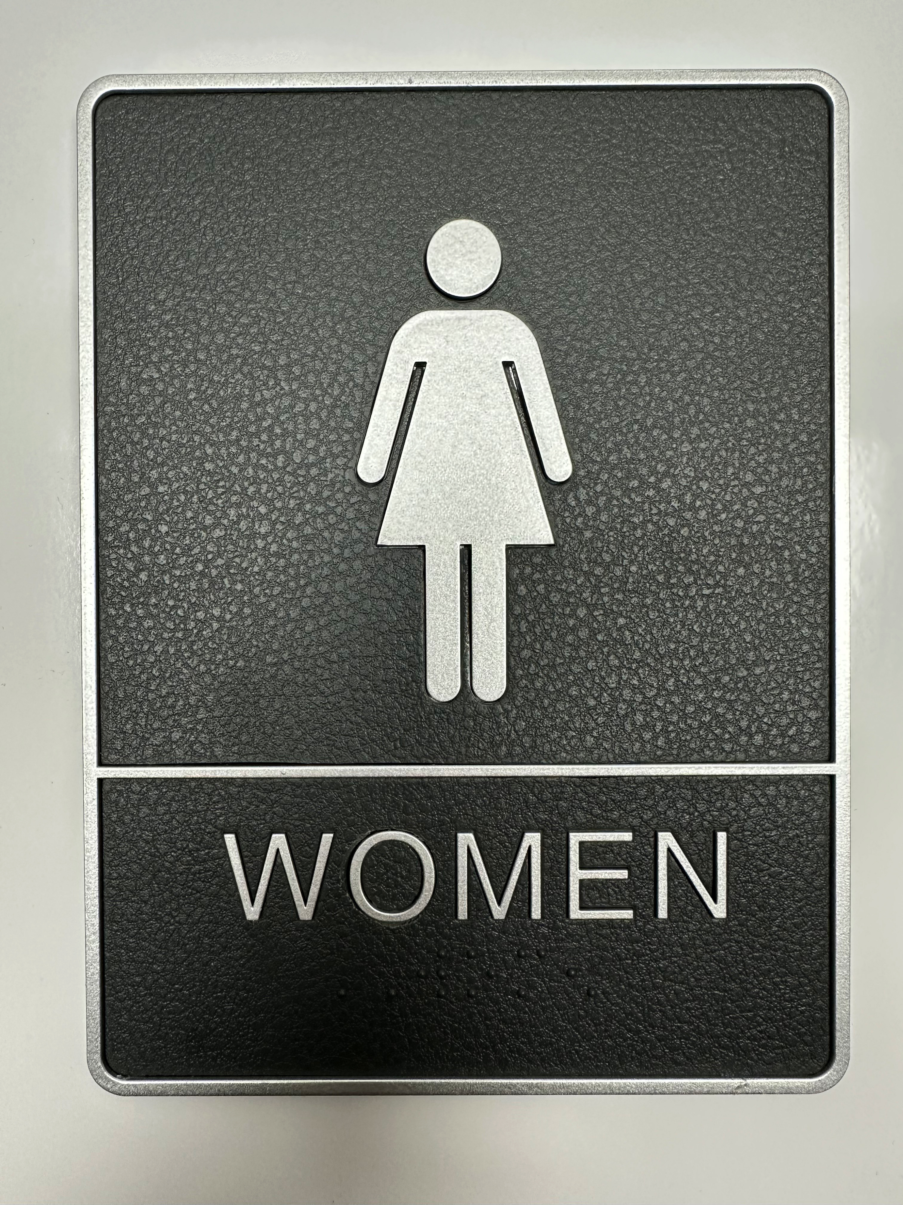 WC-Schild Woman mit Blindenschrift Schwarz Silber WC-Schild Woman mit Blindenschrift Schwarz Silber